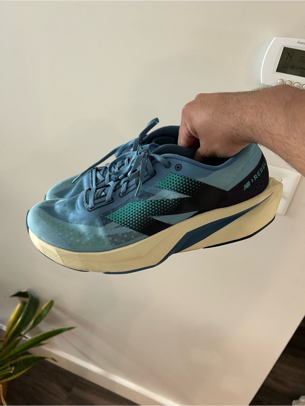 New Balance FuelCell Rebel V4 light blue and teal men’s running training shoe